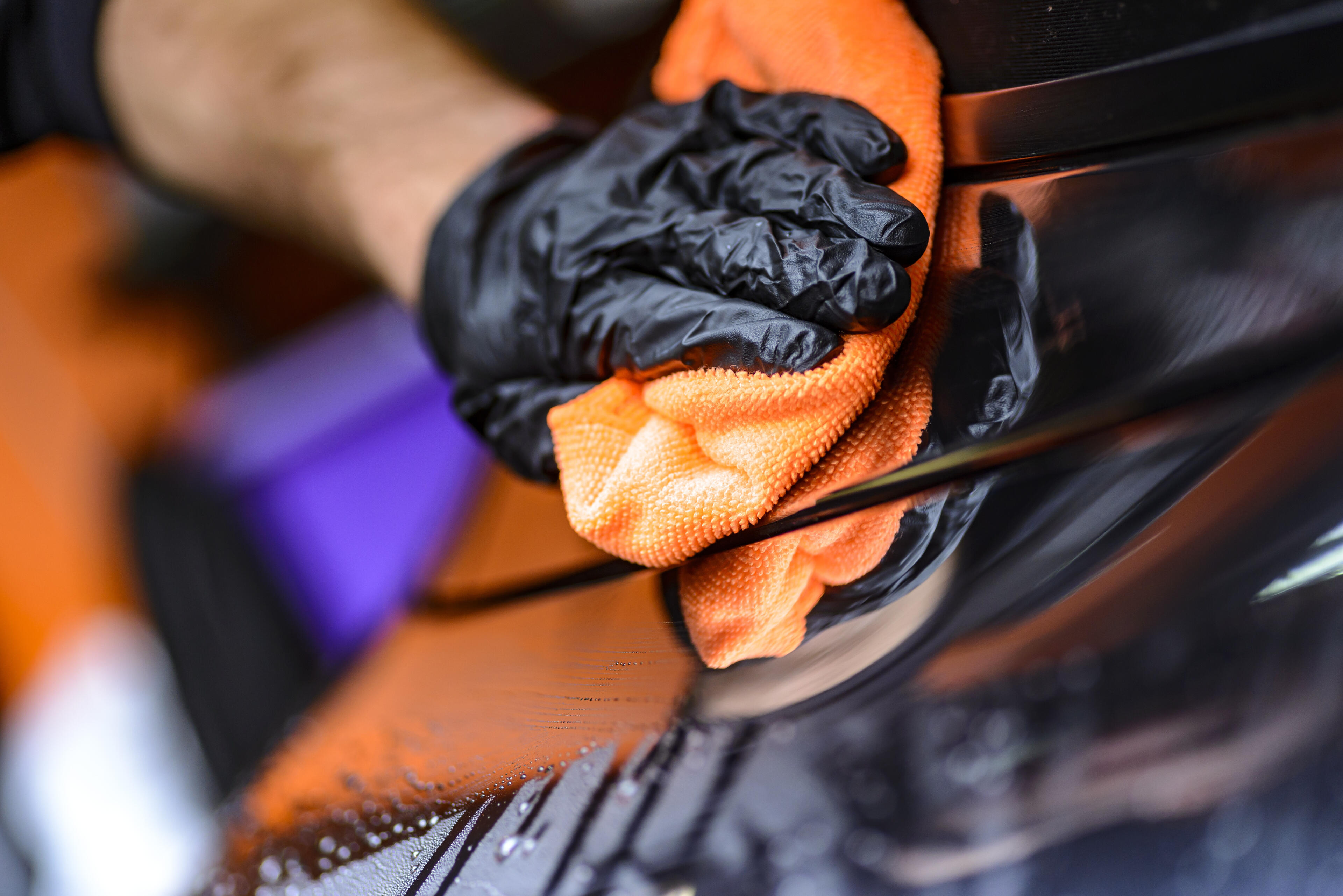 Deep Cleaning Service Professional cleaner deep cleaning a glossy household surface with a microfiber cloth.