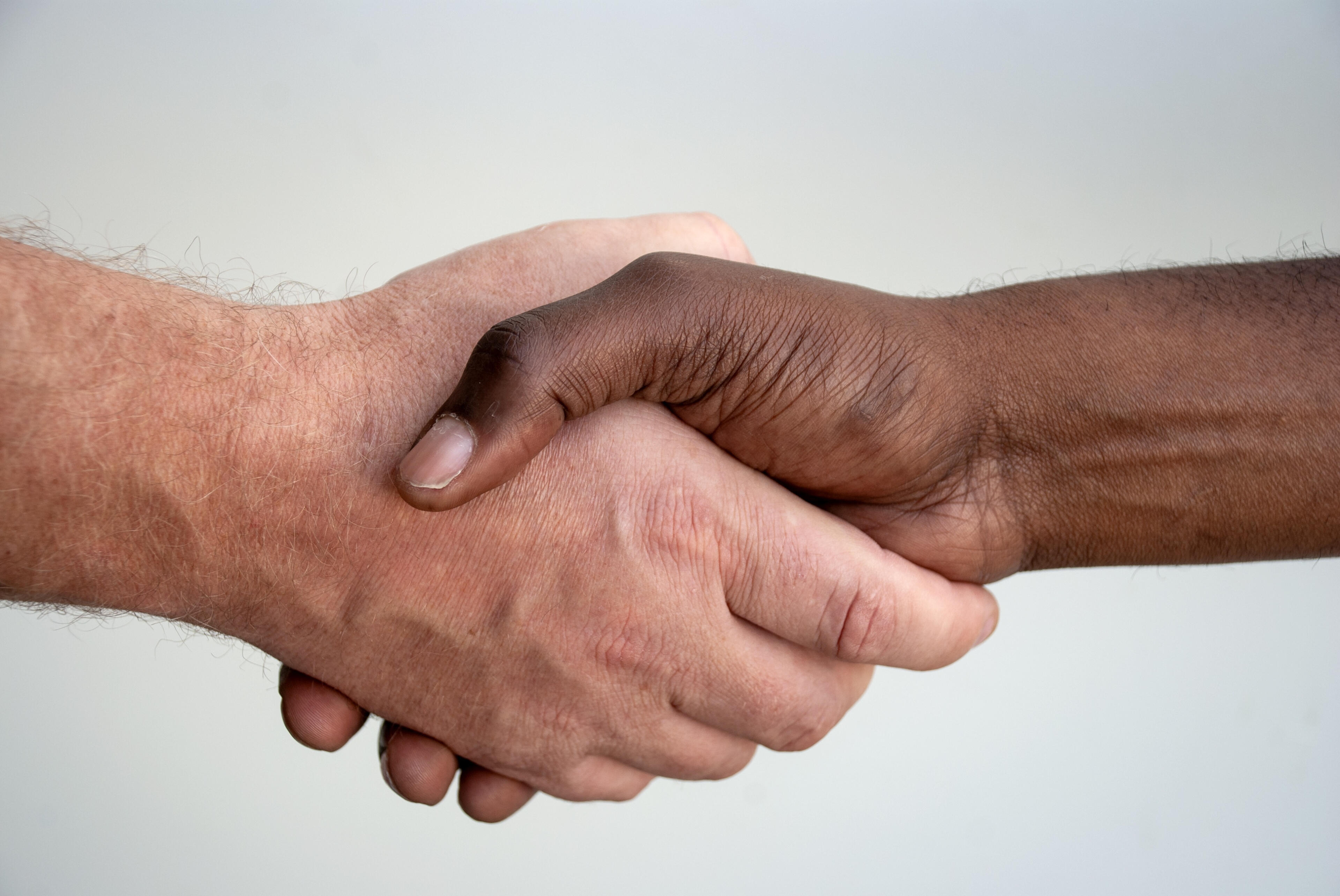 Satisfaction Guaranteed Handshake symbolizing customer satisfaction and trusted professional cleaning services.
